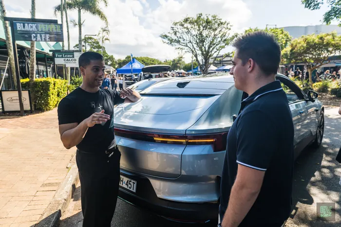 Adam talking with a Polestar representative at the back of the Polestar 4